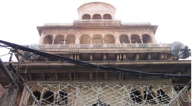 Devotees at Banke Bihari Temple with police barricades for crowd control in Vrindavan